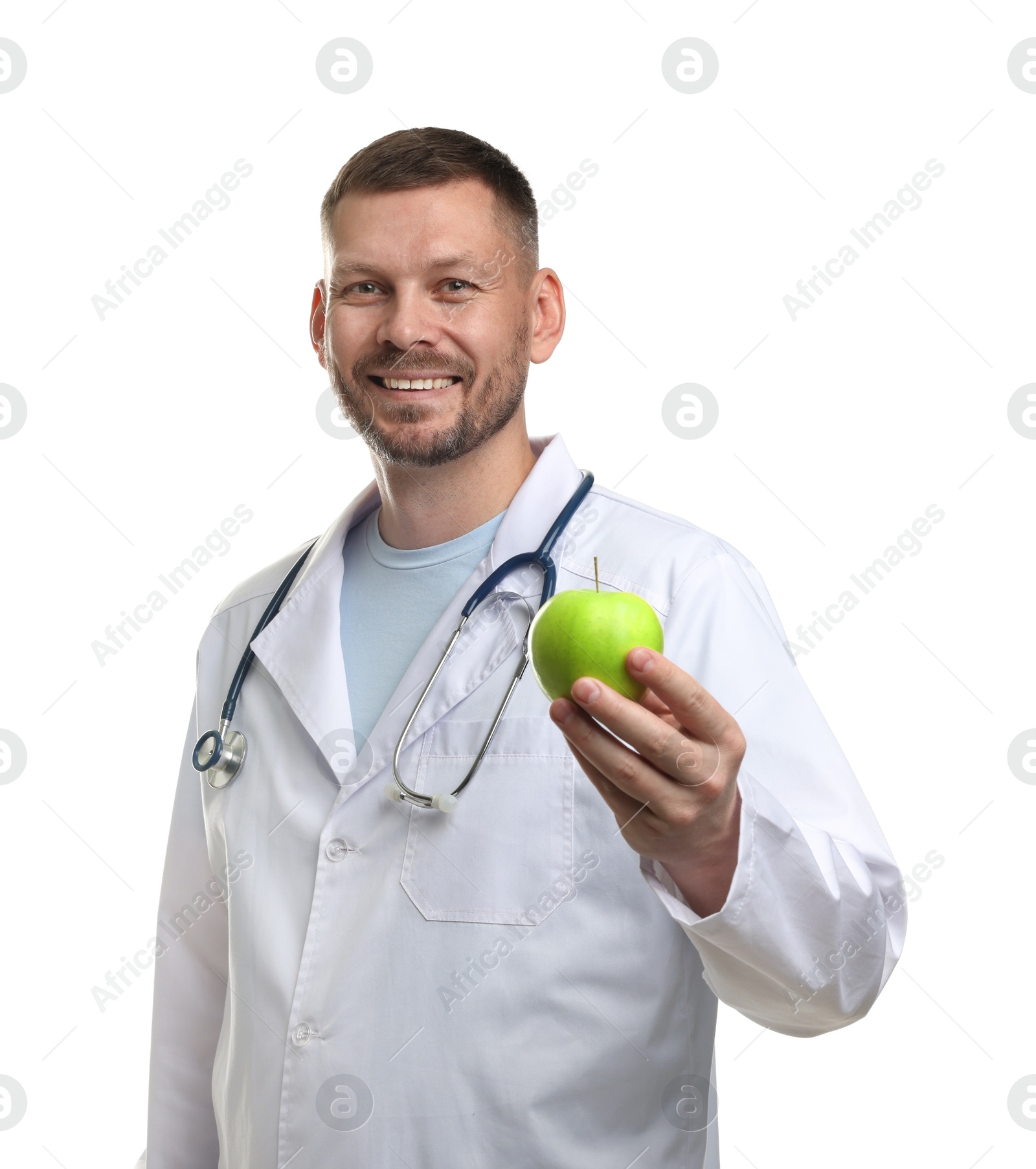 Photo of Nutritionist with green apple and stethoscope on white background