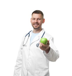 Photo of Nutritionist with green apple and stethoscope on white background