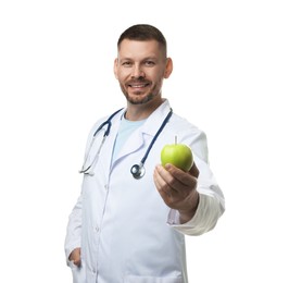 Photo of Nutritionist with green apple and stethoscope on white background