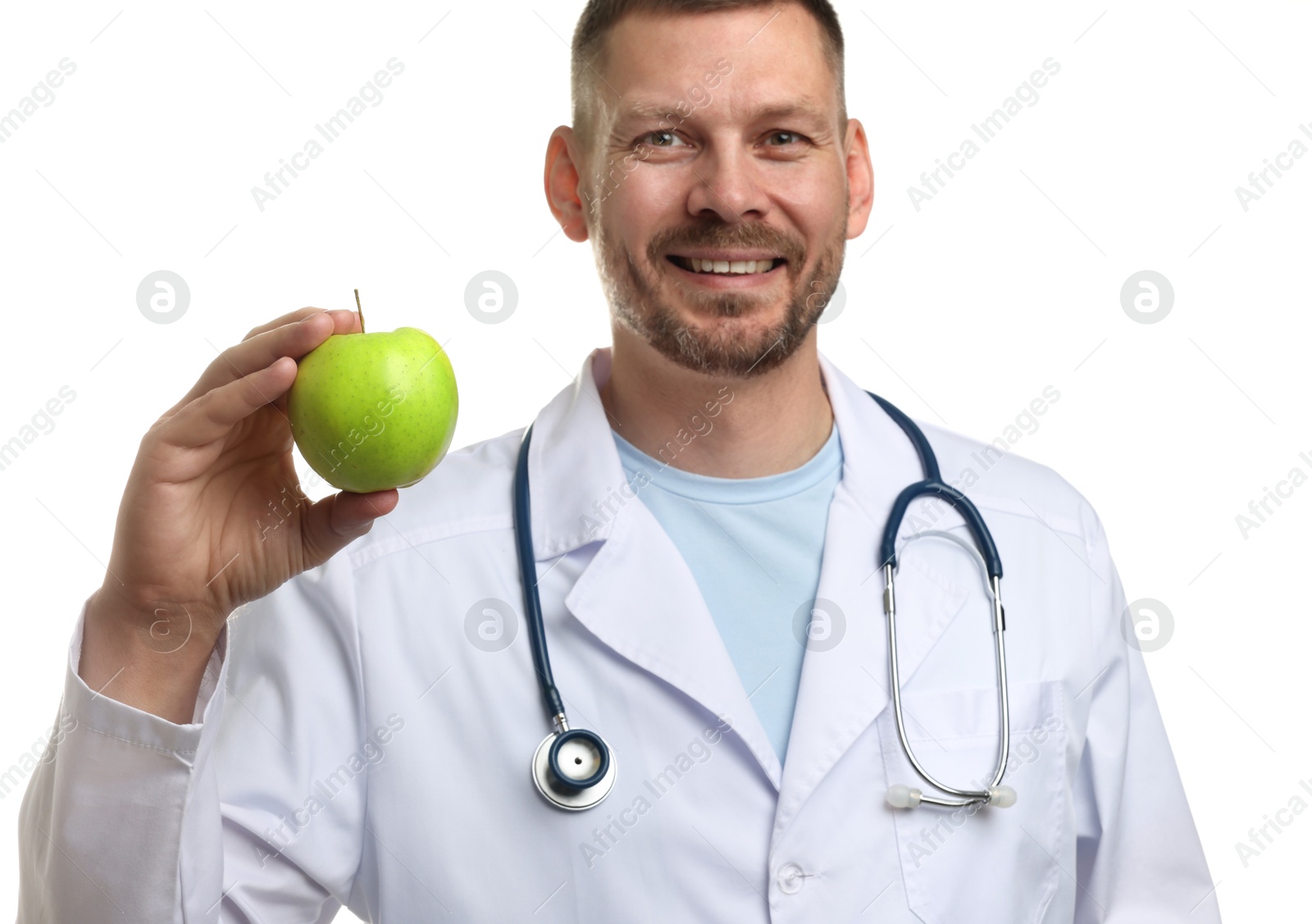 Photo of Nutritionist with green apple and stethoscope on white background