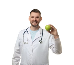 Photo of Nutritionist with green apple and stethoscope on white background