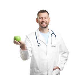 Photo of Nutritionist with green apple and stethoscope on white background