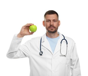 Photo of Nutritionist with green apple and stethoscope on white background