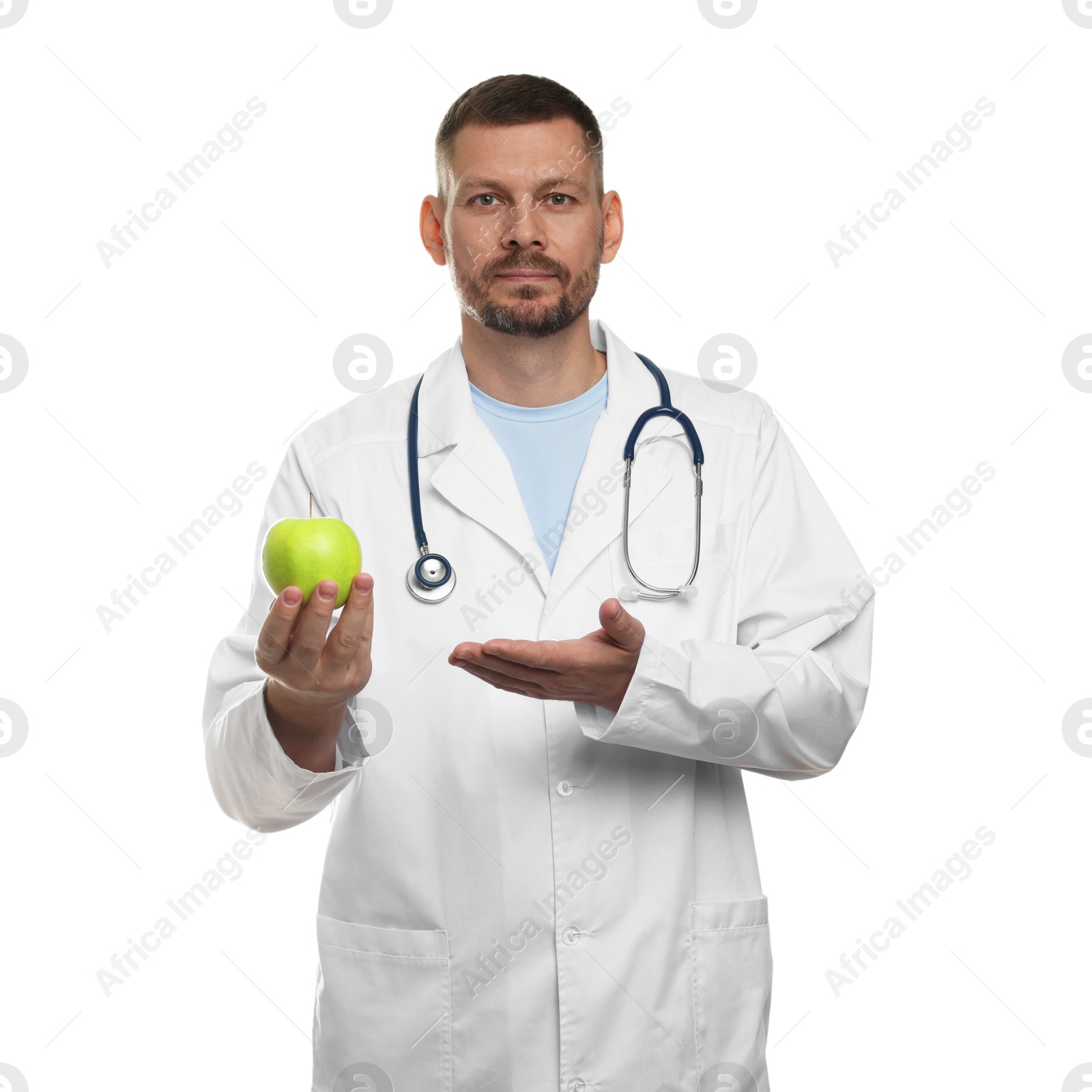 Photo of Nutritionist with green apple and stethoscope on white background