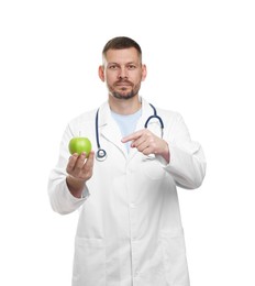 Photo of Nutritionist with green apple and stethoscope on white background