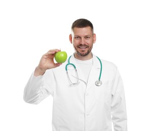 Photo of Nutritionist with green apple and stethoscope on white background