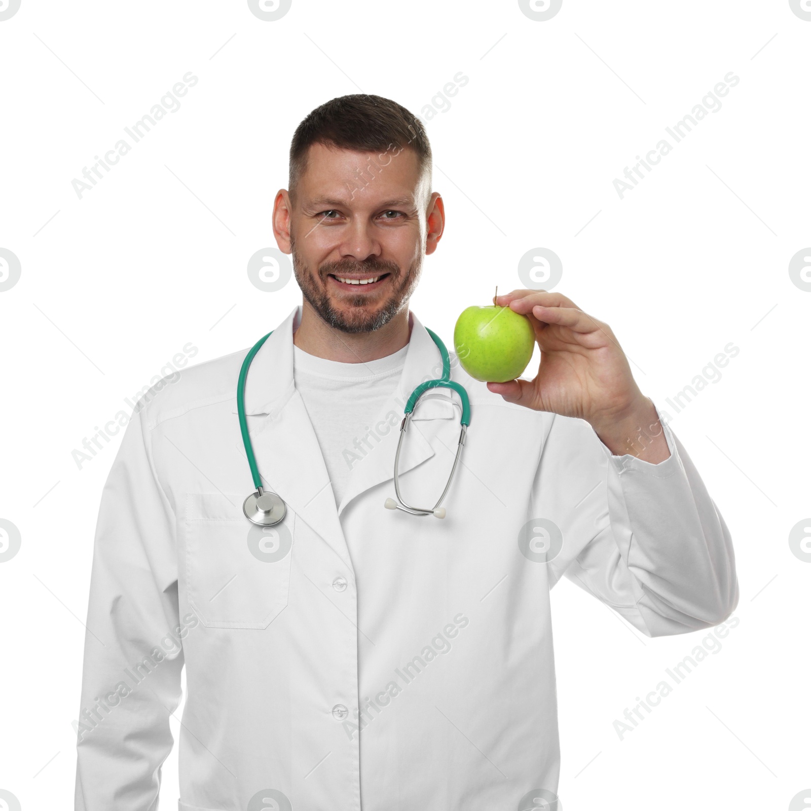 Photo of Nutritionist with green apple and stethoscope on white background
