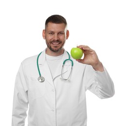 Photo of Nutritionist with green apple and stethoscope on white background
