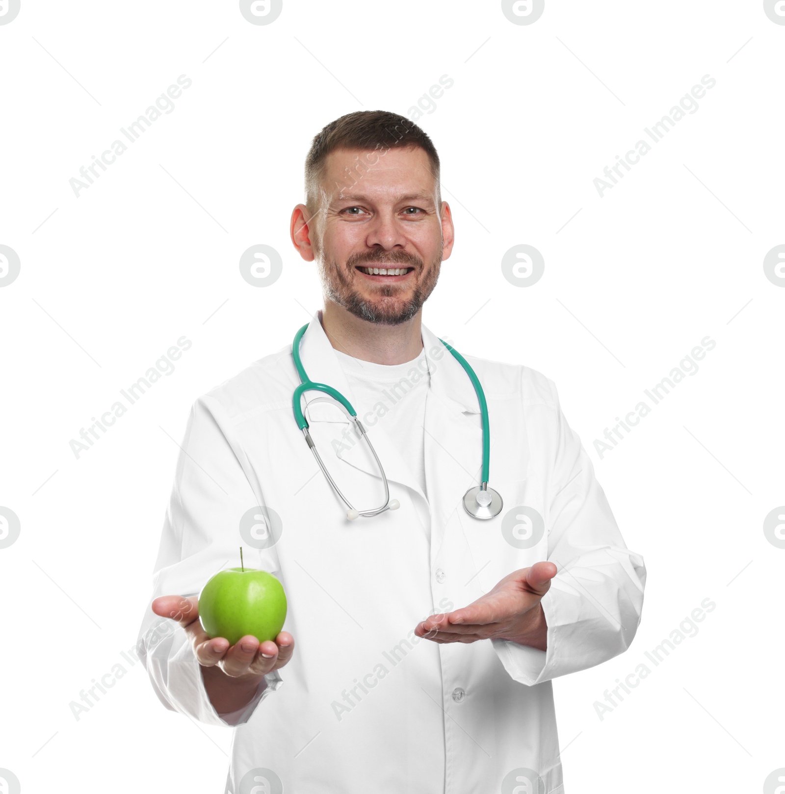 Photo of Nutritionist with green apple and stethoscope on white background
