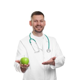 Photo of Nutritionist with green apple and stethoscope on white background
