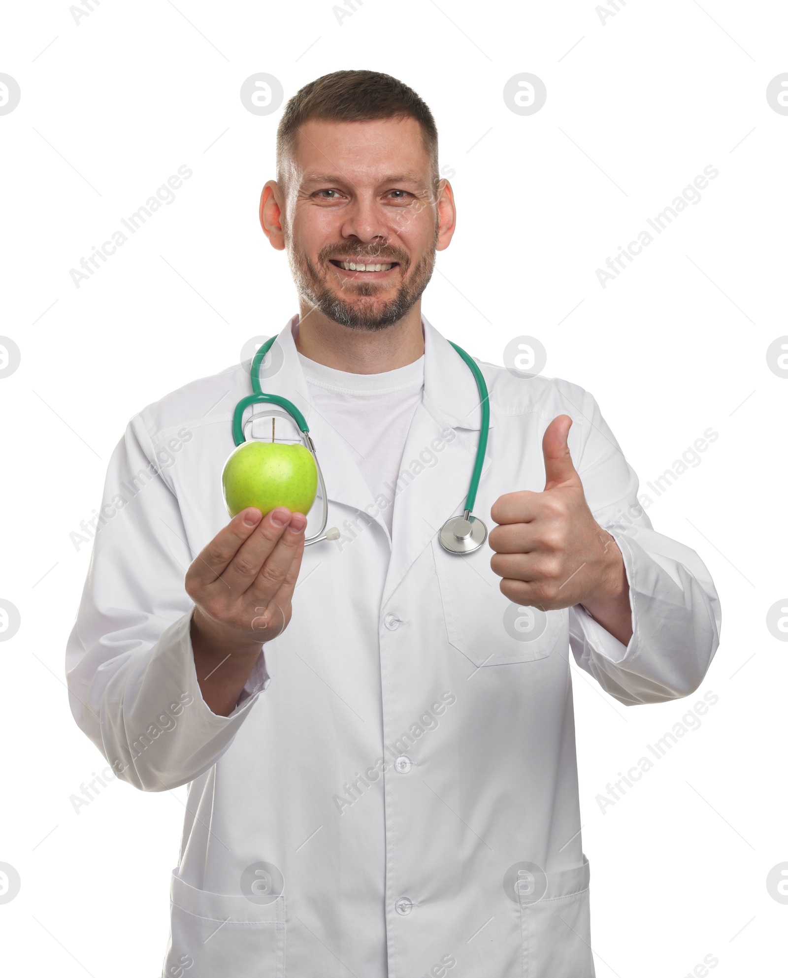 Nutritionist with green apple and stethoscope showing thumbs up on white background Photo of Nutritionist with green apple and stethoscope showing thumbs up on white background