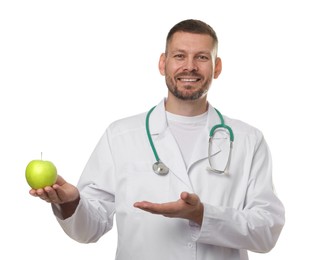 Photo of Nutritionist with green apple and stethoscope on white background
