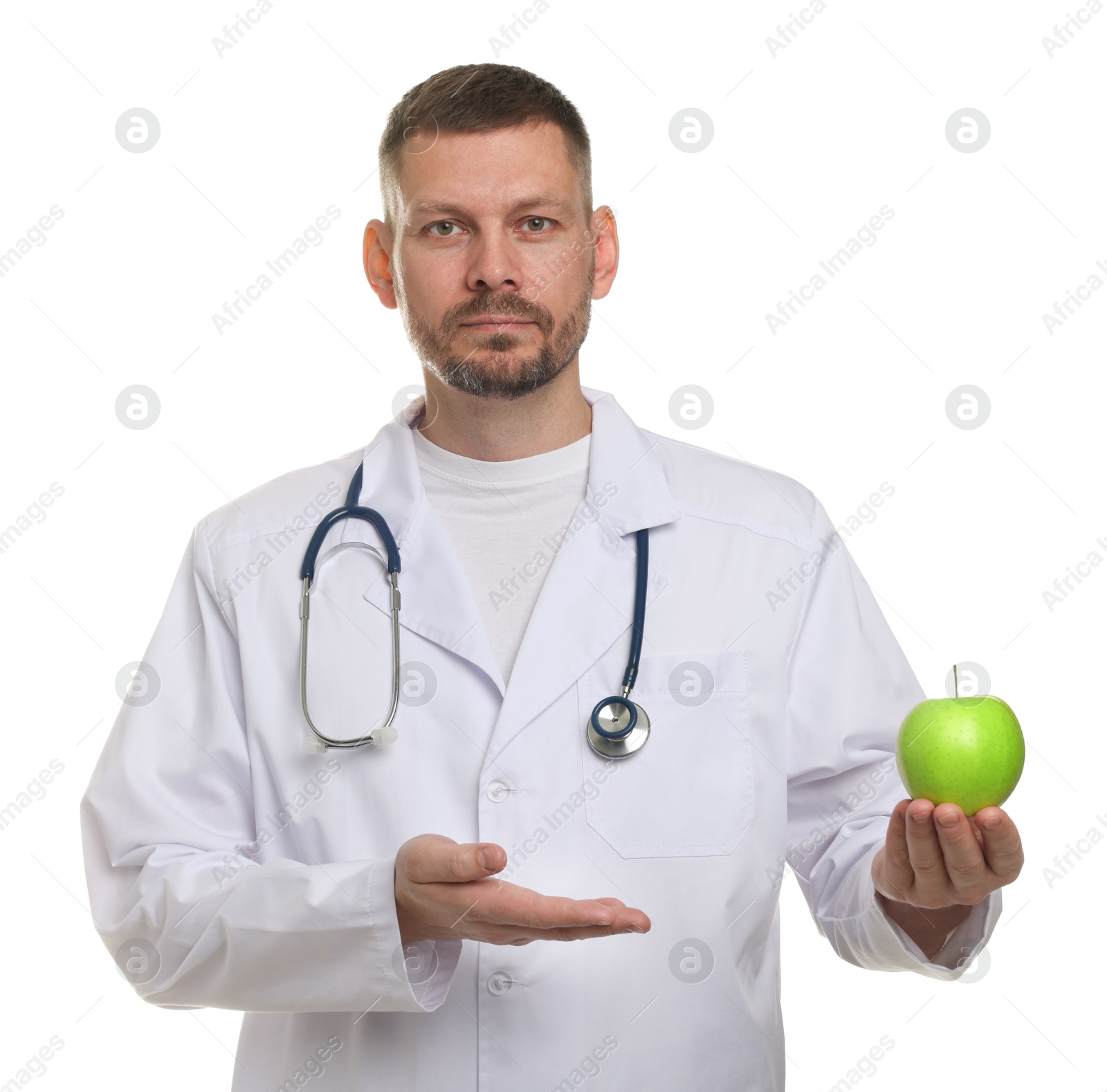 Nutritionist with green apple and stethoscope on white background Photo of Nutritionist with green apple and stethoscope on white background
