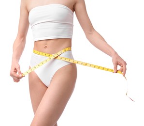 Photo of Woman with slim body and measuring tape on white background, closeup