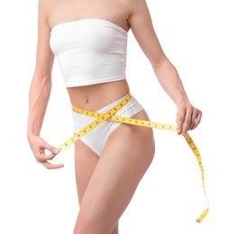 Photo of Woman with slim body and measuring tape on white background, closeup