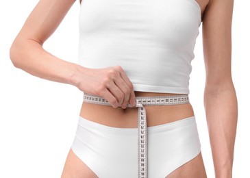 Photo of Woman with slim body and measuring tape on white background, closeup
