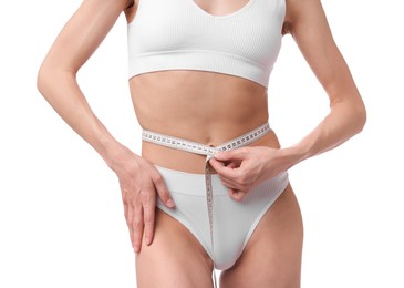 Photo of Woman with slim body and measuring tape on white background, closeup