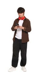 Photo of Teenage boy with headphones and smartphone on white background