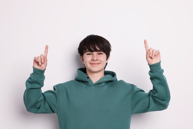 Photo of Portrait of teenage boy on white background