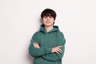 Photo of Portrait of teenage boy on white background
