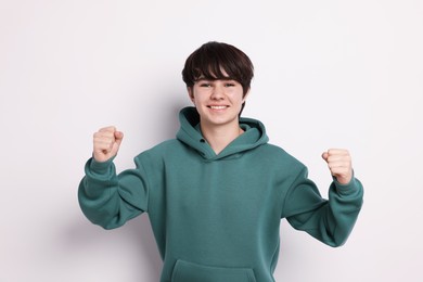 Photo of Portrait of teenage boy on white background