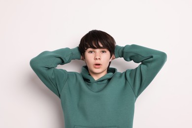 Photo of Portrait of teenage boy on white background