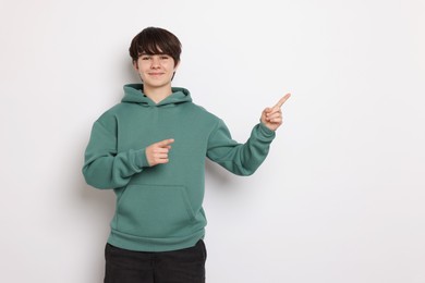 Photo of Portrait of teenage boy on white background, space for text