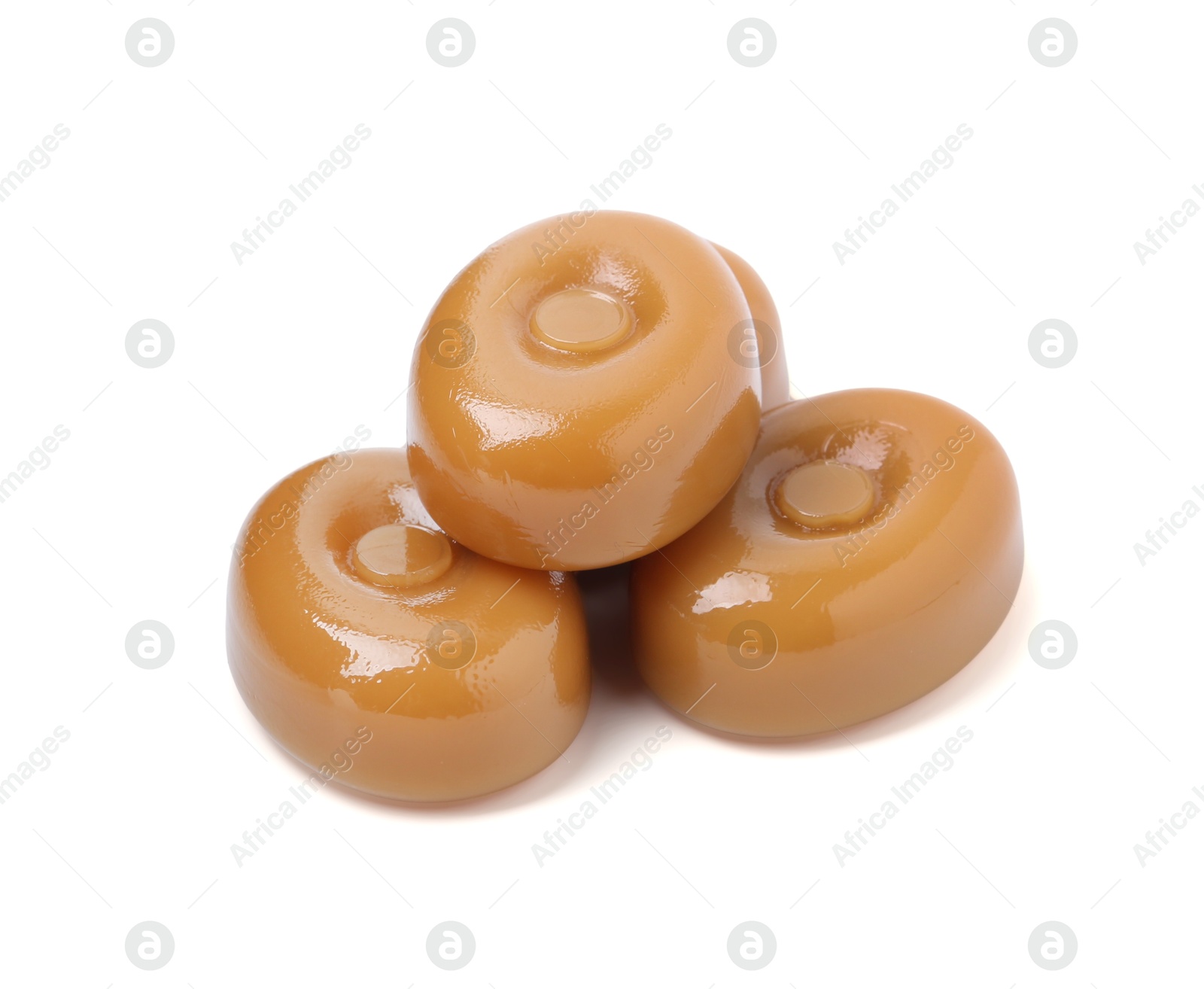 Tasty hard toffee candies isolated on white Photo of Tasty hard toffee candies isolated on white