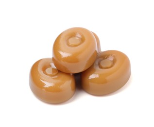 Photo of Tasty hard toffee candies isolated on white