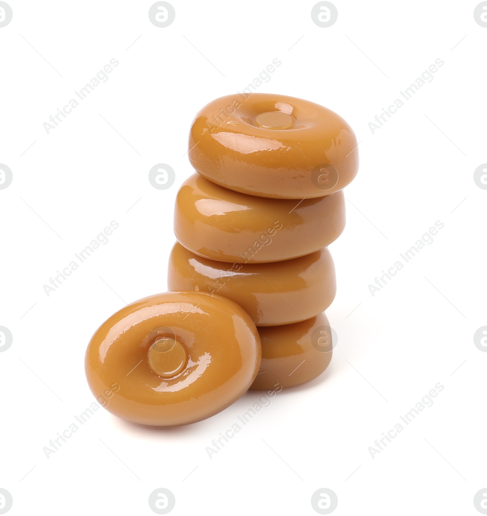 Tasty hard toffee candies isolated on white Photo of Tasty hard toffee candies isolated on white