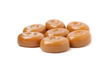 Photo of Tasty hard toffee candies isolated on white