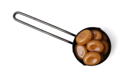 Photo of Tasty sweet caramel candies isolated on white, top view