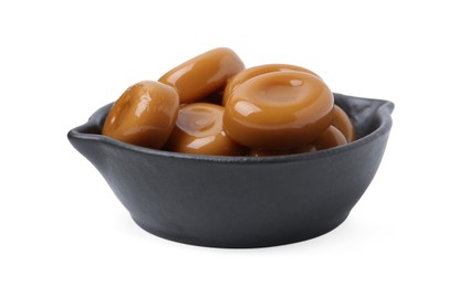 Photo of Tasty sweet caramel candies isolated on white