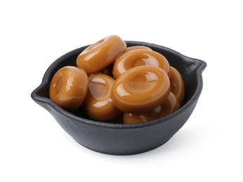 Photo of Tasty sweet caramel candies isolated on white