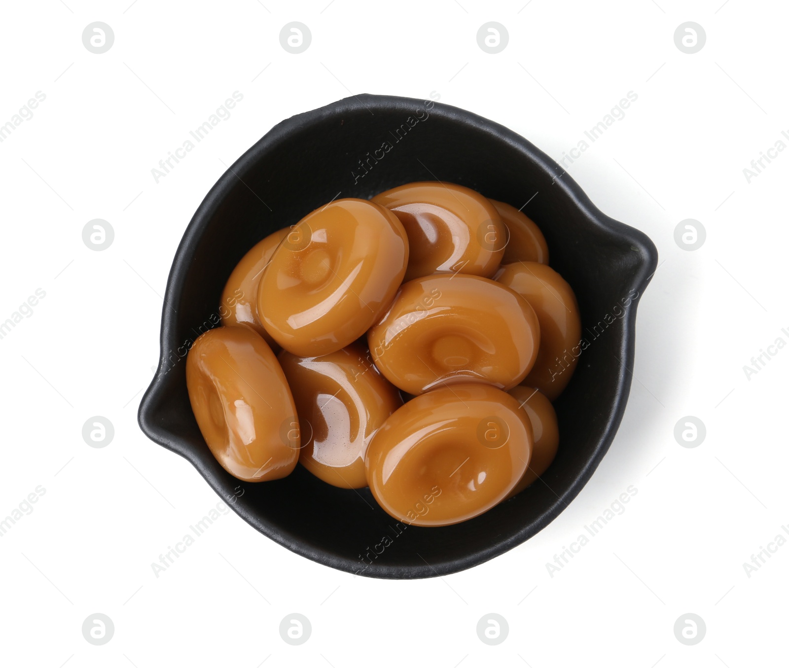 Tasty sweet caramel candies isolated on white, top view Photo of Tasty sweet caramel candies isolated on white, top view