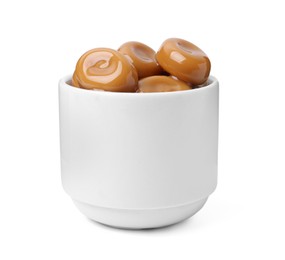 Photo of Tasty sweet caramel candies isolated on white
