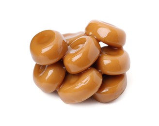 Photo of Tasty sweet caramel candies isolated on white