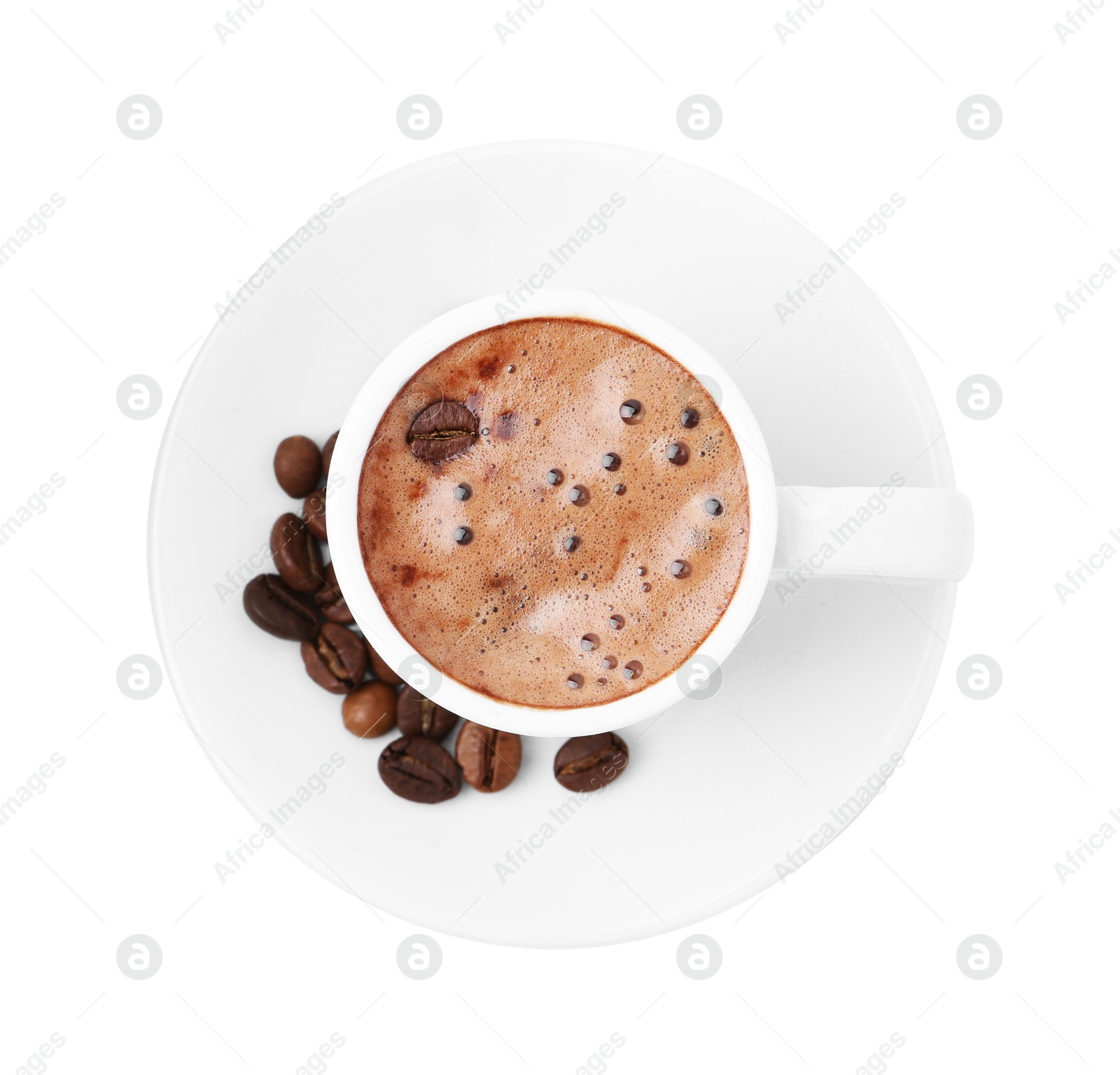 Aromatic coffee in cup, beans and saucer isolated on white, top view Photo of Aromatic coffee in cup, beans and saucer isolated on white, top view