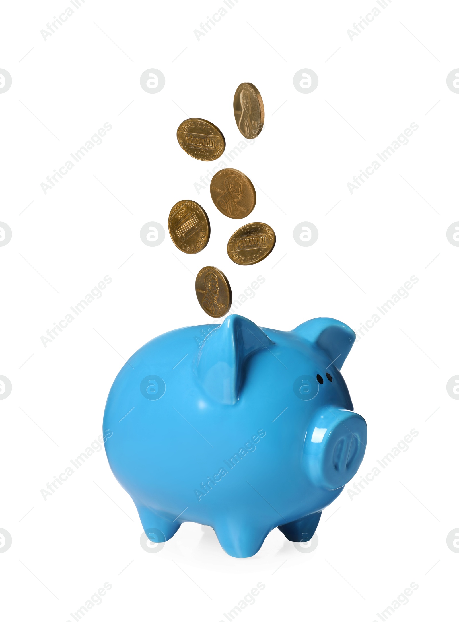 Coins falling into light blue piggy bank on white background Image of Coins falling into light blue piggy bank on white background