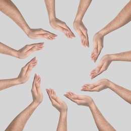 Image of Making circle of human hands on grey background. Unity, partnership, cooperation