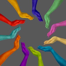 Image of Making circle of human hands painted in different colors on grey background. Unity, partnership, cooperation