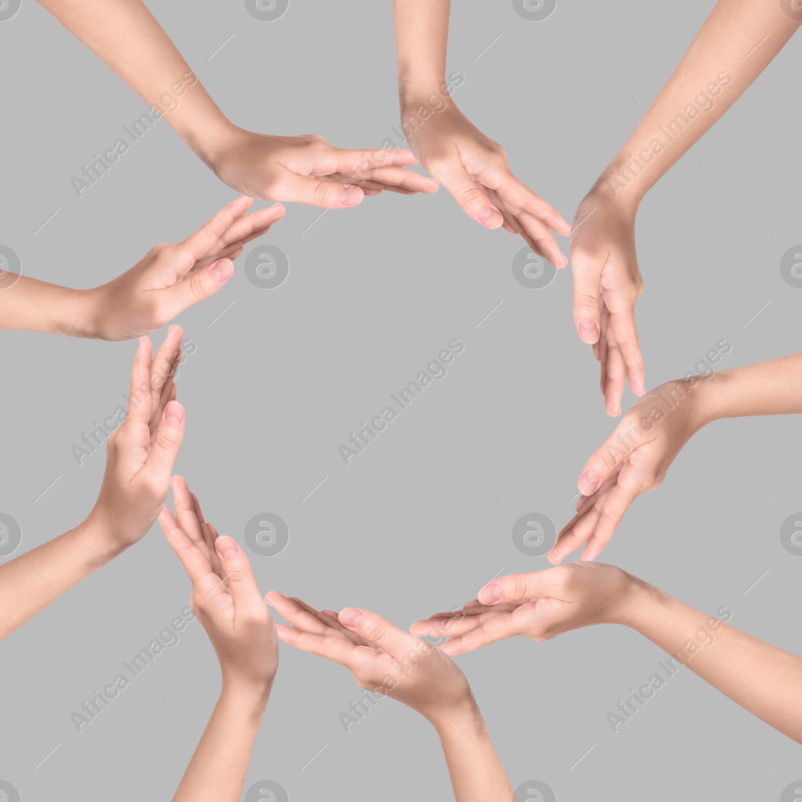 Making circle of human hands on grey background. Unity, partnership, cooperation Image of Making circle of human hands on grey background. Unity, partnership, cooperation