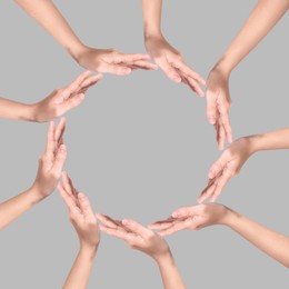 Image of Making circle of human hands on grey background. Unity, partnership, cooperation