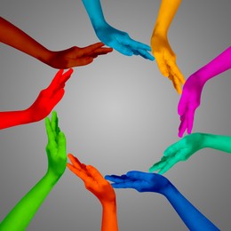 Image of Making circle of human hands painted in different colors on grey background. Unity, partnership, cooperation