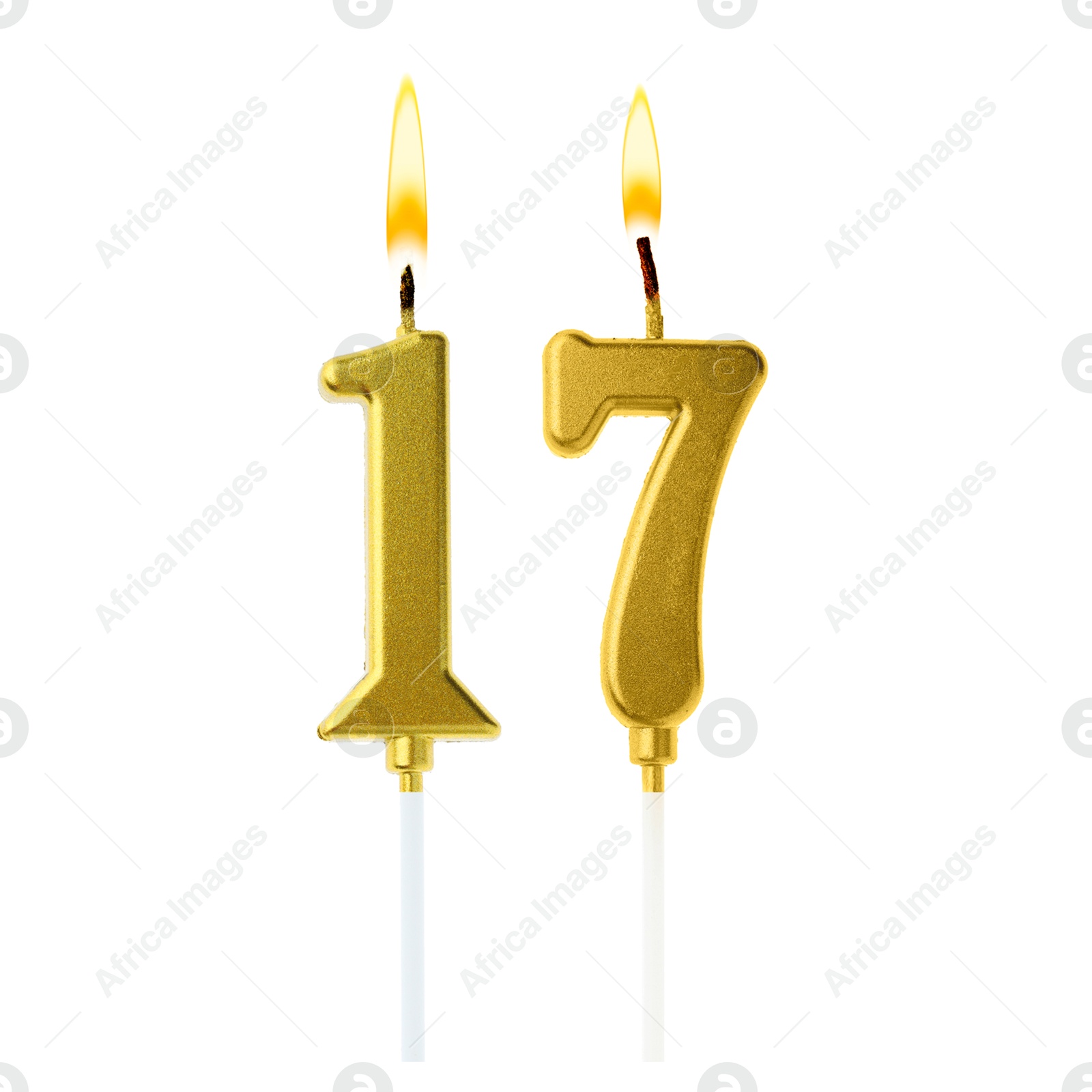 Burning golden cake candles composing number 17 on white background. Festive decoration for birthday or other special date Image of Burning golden cake candles composing number 17 on white background. Festive decoration for birthday or other special date