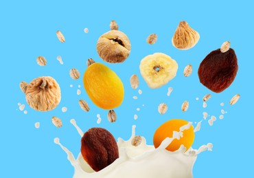 Image of Milk splash with oat flakes and dried fruits in air on light blue background. Healthy breakfast