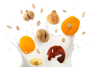 Image of Milk splash with oat flakes and dried fruits in air on white background. Healthy breakfast
