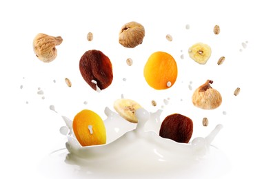 Image of Milk splash with oat flakes and dried fruits in air on white background. Healthy breakfast