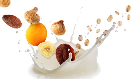 Image of Milk splash with oat flakes and dried fruits in air on white background. Healthy breakfast