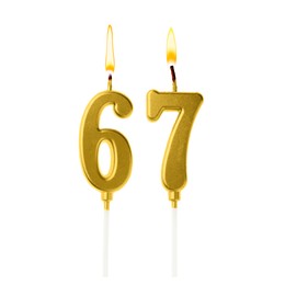 Image of Burning golden cake candles composing number 67 on white background. Festive decoration for birthday or other special date